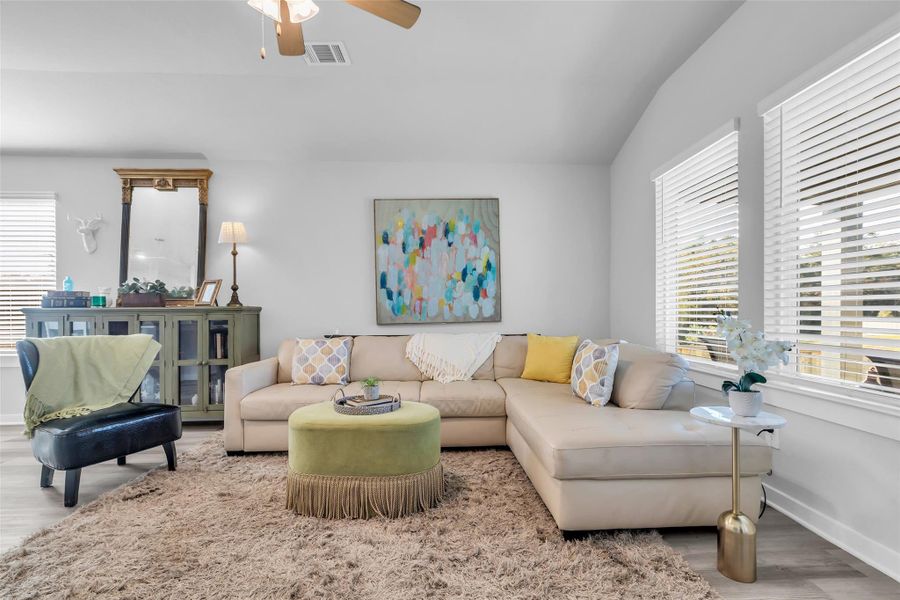 Gorgeous great room overlooks back covered patio.