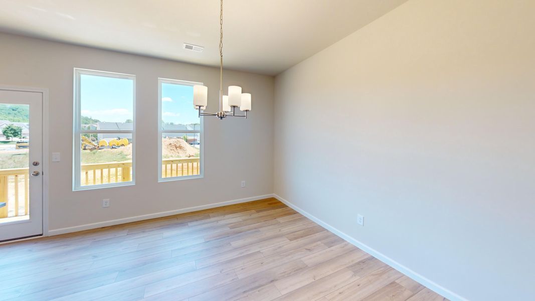 The dining area is just off the kitchen with easy access to the deck. Perfect for entertaining!