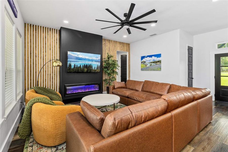 Unique statement wall flanks focal point fireplace and TV