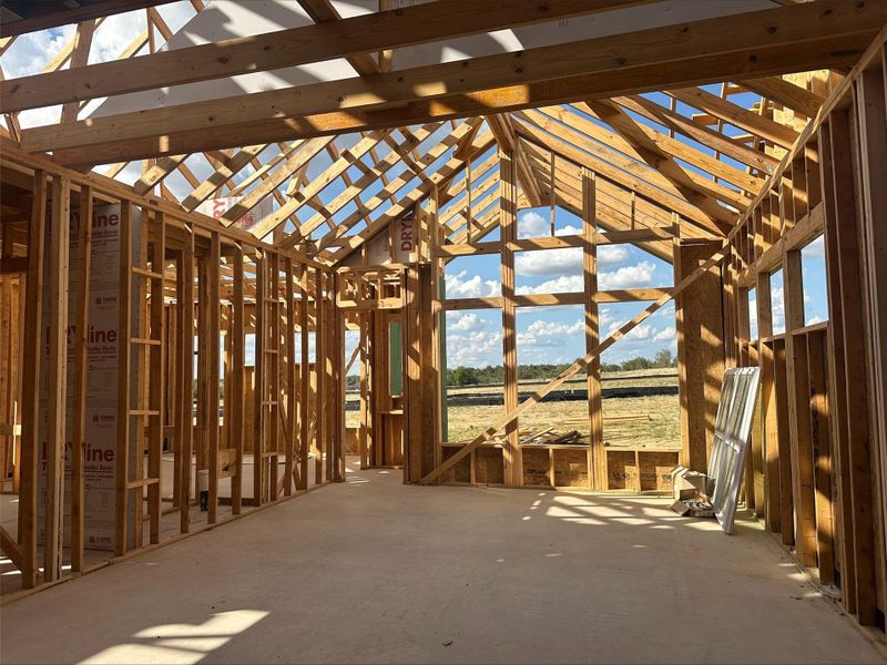 Framed walls and a high vaulted ceiling define this home's airy interior. Framed walls and a high vaulted ceiling define this home's airy interior.