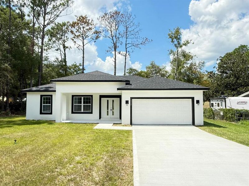 Front exterior of a new home in , Citrus Springs, FL, highlighting curb appeal (Image 20). Front exterior of a new home in , Citrus Springs, FL, highlighting curb appeal (Image 20).