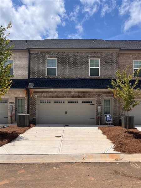 Front exterior of a new home in Governors Parc, Kennesaw, GA, highlighting curb appeal (Image 23). Front exterior of a new home in Governors Parc, Kennesaw, GA, highlighting curb appeal (Image 23).