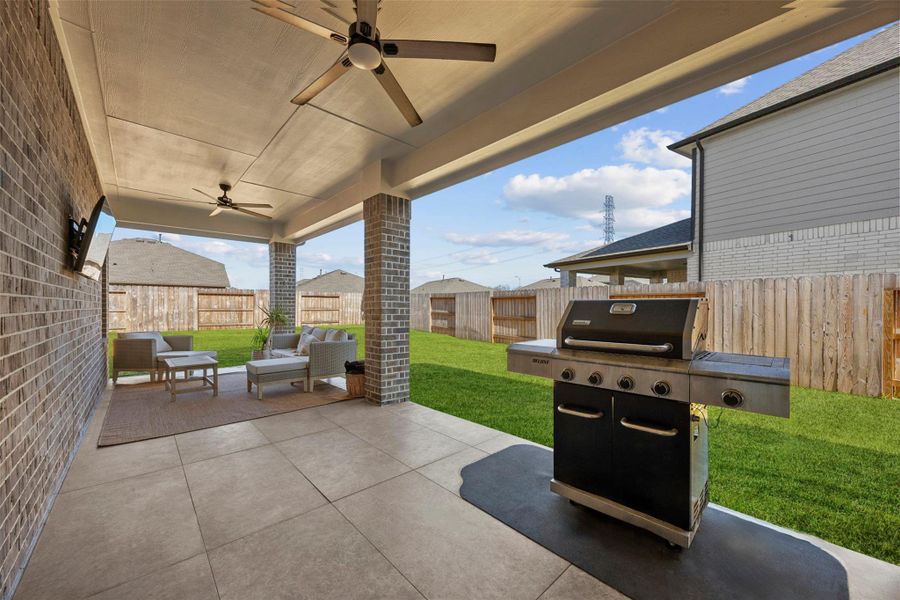 Exterior details and patio area of a home in Sunterra, Katy (Image 22).