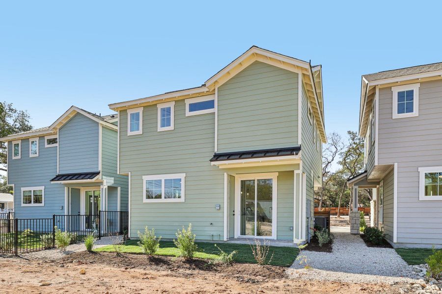 Rear view of house with a standing seam roof