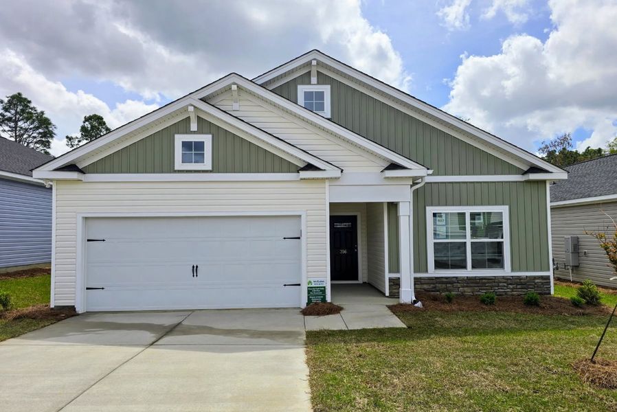 Representative exterior photo of a completed home built from the Spruce L by McGuinn Homes in Canary Woods, Hopkins, SC (Image 15). Representative exterior photo of a completed home built from the Spruce L by McGuinn Homes in Canary Woods, Hopkins, SC (Image 15).