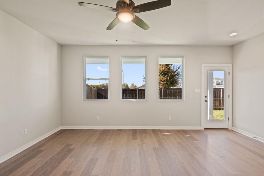 Empty room with light wood-style floors and ceiling fan Empty room with light wood-style floors and ceiling fan