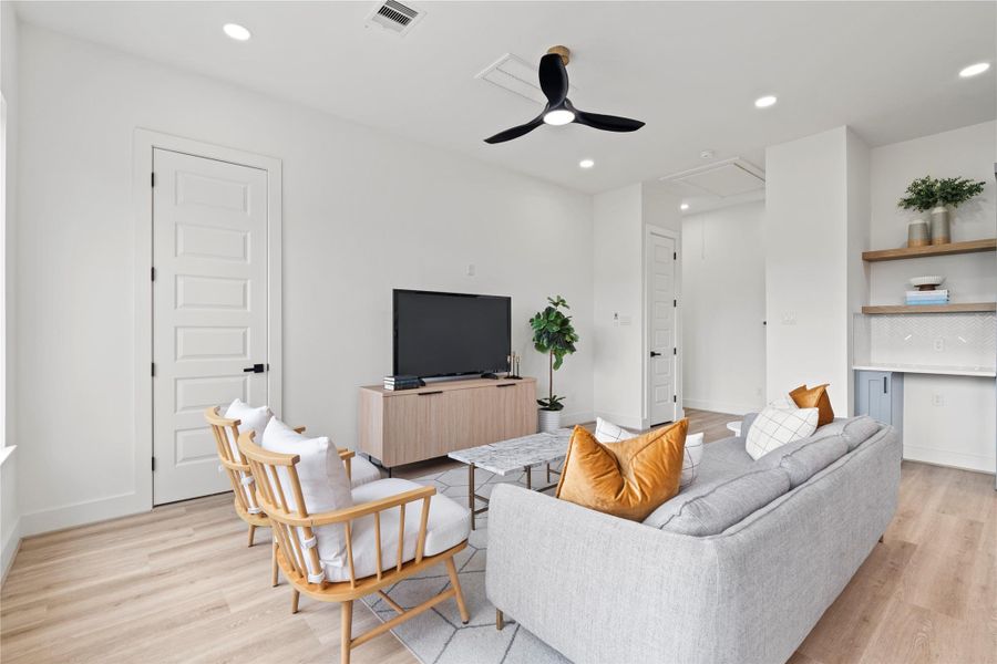 The living area feels like a breath of fresh air—defined by simplicity, layered in warmth, and elevated by thoughtful proportions.