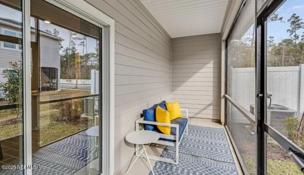 Exterior details and patio area of a home in Silver Falls Townhomes at Silverleaf, St. Johns (Image 2).