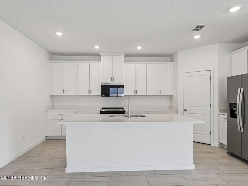 Furnished interior view inside a new home in Colbert Landings, Palm Coast (Image 3).