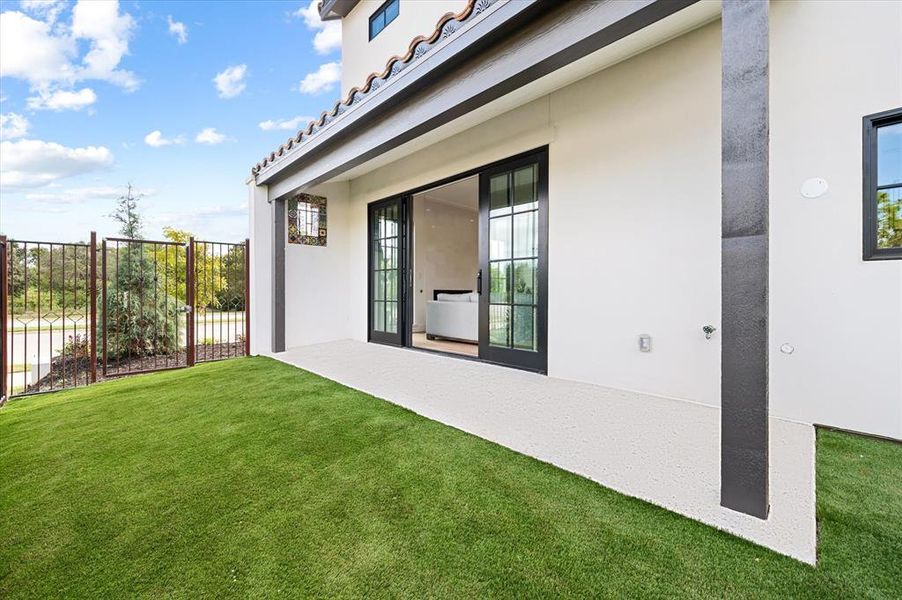 Turfed, expanded side yard with direct entry from living room