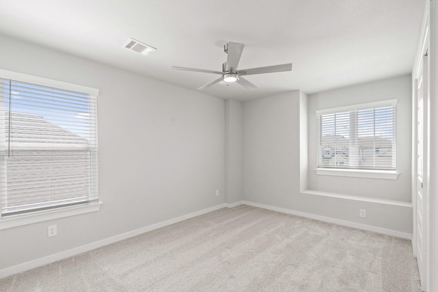 Spacious, unfurnished interior of a new home in Sunterra, Katy (Image 11).