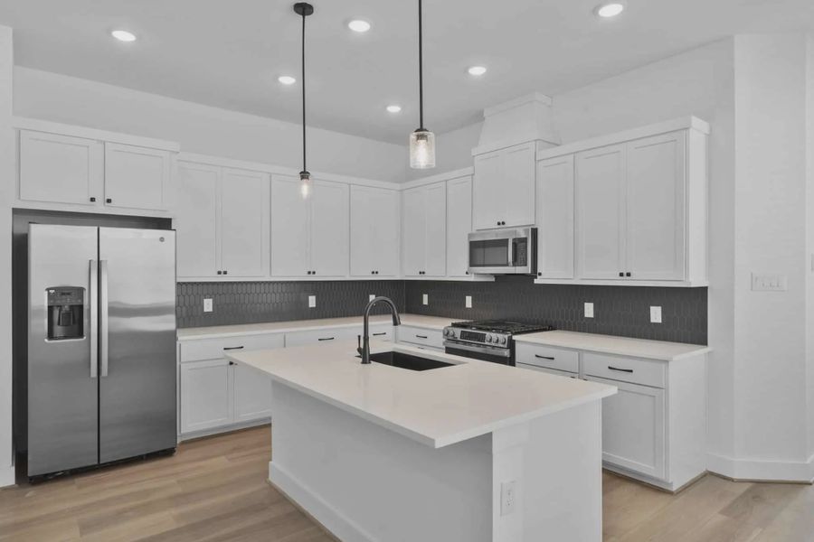 Representative furnished interior of a home built from the Versailles by Chesmar Homes in Meridiana Chateau, Manvel (Image 5).