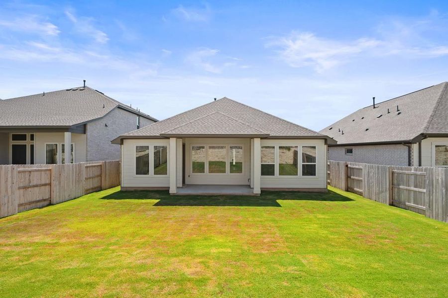 Exterior details and patio area of a home in Lariat, Liberty Hill (Image 26).