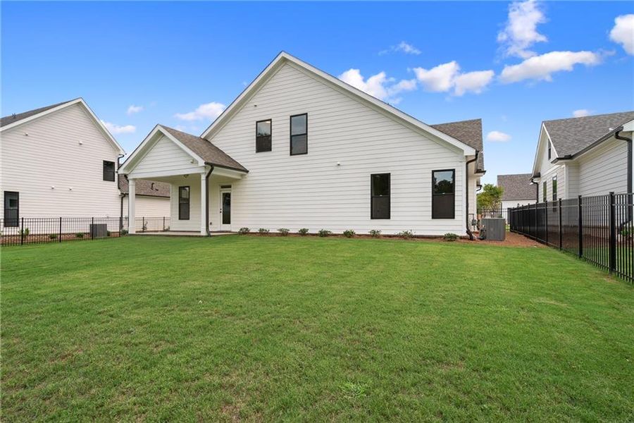 Exterior details and patio area of a home in Promenade at Sawnee Village, Cumming (Image 30).