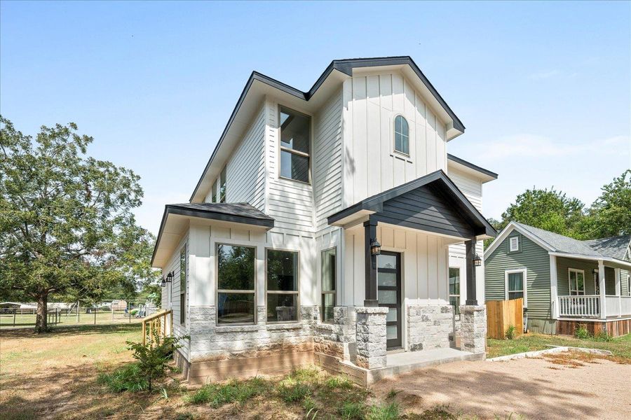 Front exterior of a new home in , Smithville, TX, highlighting curb appeal (Image 24).