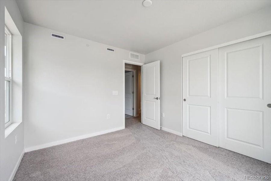 Spacious, unfurnished interior of a new home in Legato, Commerce City (Image 19).