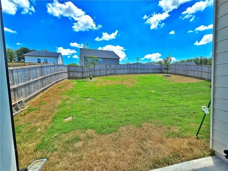 Exterior details and patio area of a home in Oakchase at Hampton, Hampton (Image 3).