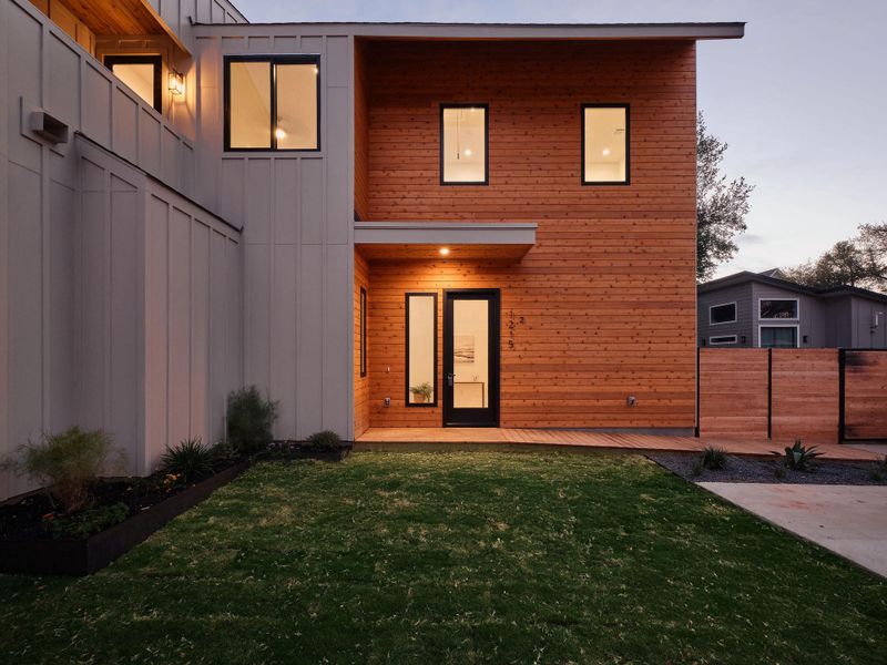 Back of property with board and batten siding Back of property with board and batten siding