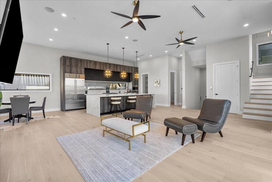 Talk about an open concept — the living, kitchen, and dining areas flow together seamlessly, creating a bright and inviting space perfect for everyday living and entertaining.
