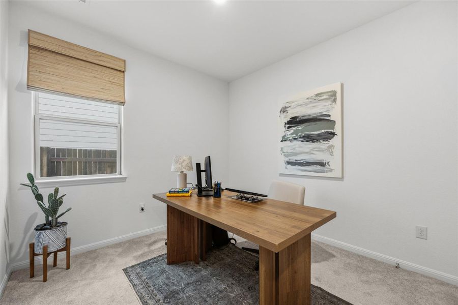 Versatile room featuring light carpeting and white walls