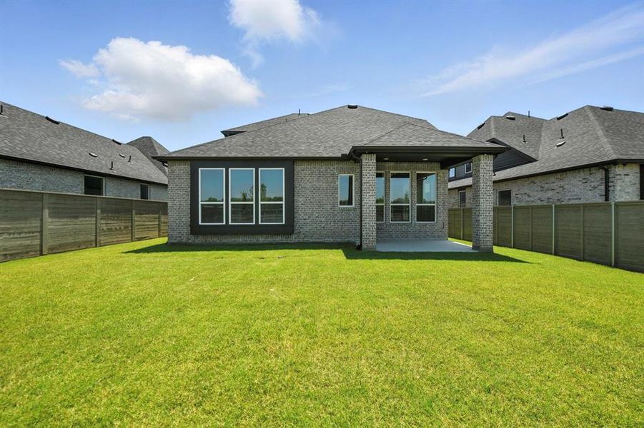 Exterior details and patio area of a home in Treeline, Justin (Image 1).