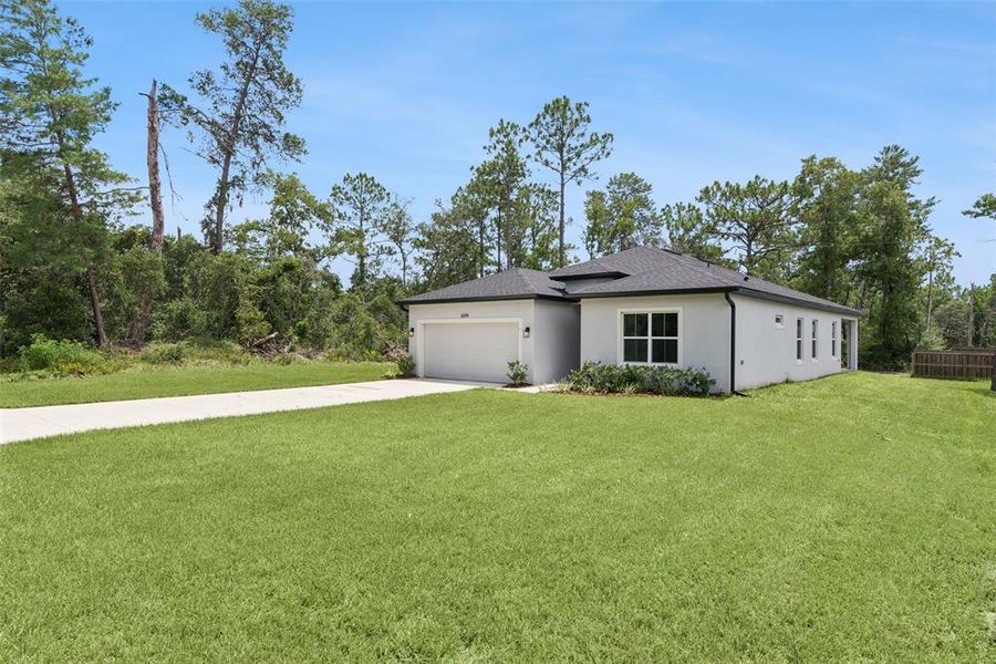 Front exterior of a new home in , Ocala, FL, highlighting curb appeal (Image 17).