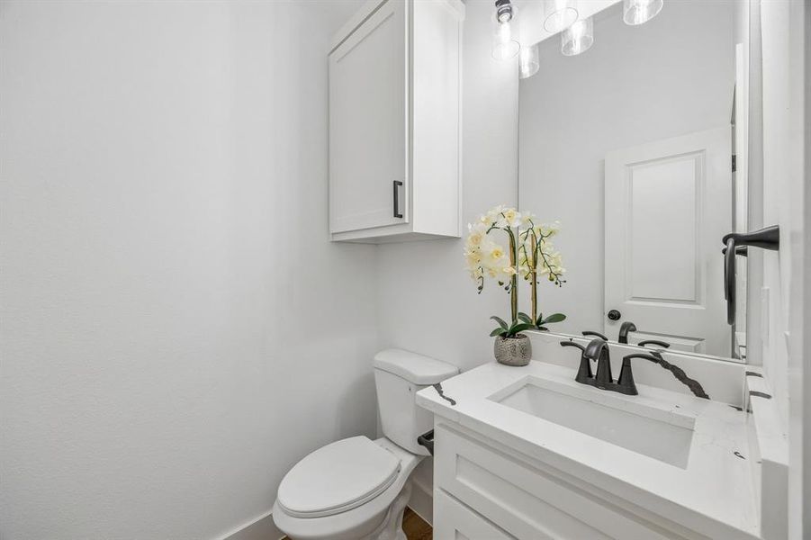 Powder room featuring a vanity