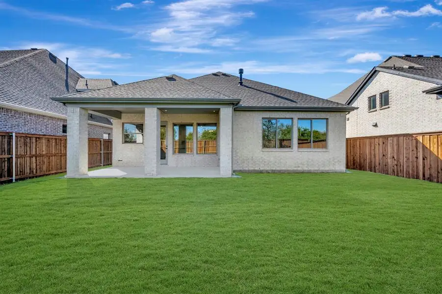 Exterior details and patio area of a home in South Pointe  Cottage Series, Mansfield (Image 1).