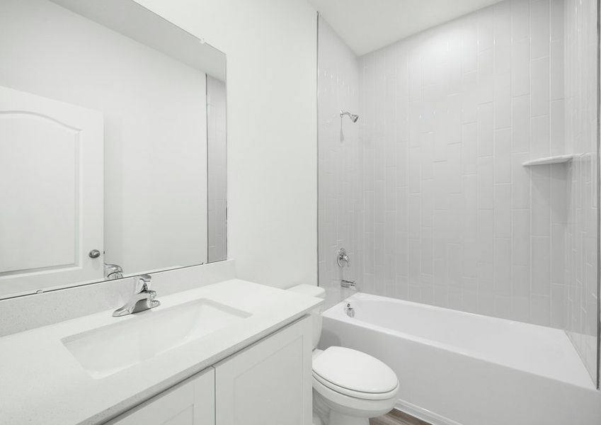 The secondary bathroom has a beautifully tiled shower tub combo The secondary bathroom has a beautifully tiled shower tub combo