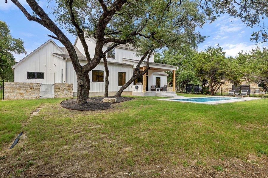 Generous backyard features a sparkling pool and covered patio for year-round outdoor enjoyment. Generous backyard features a sparkling pool and covered patio for year-round outdoor enjoyment.