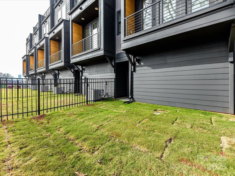 Exterior details and patio area of a home in North End Terraces, Charlotte (Image 16).