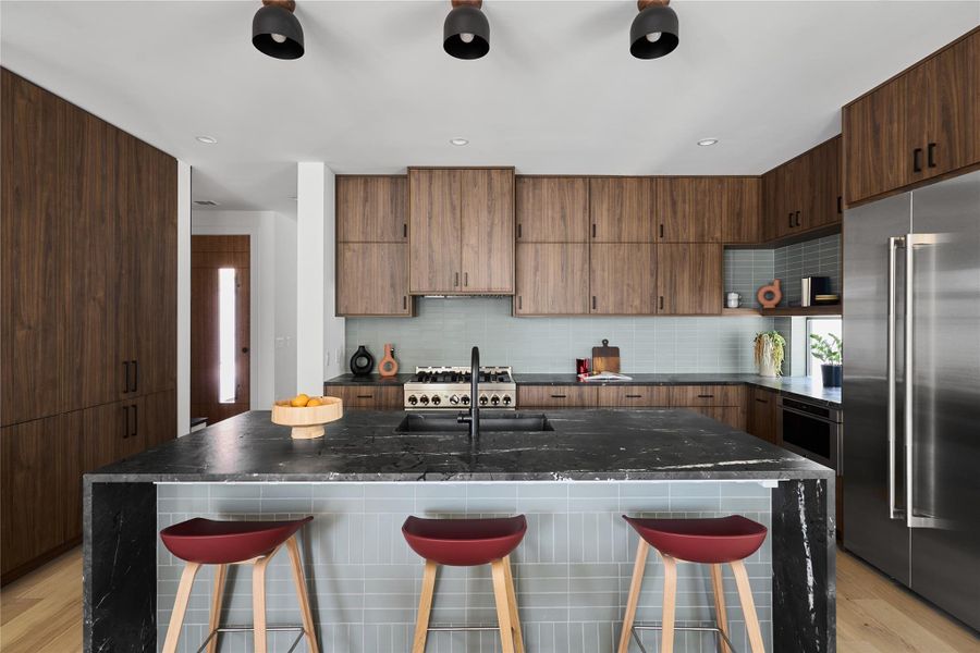 Moody kitchen with walnut cabinetry