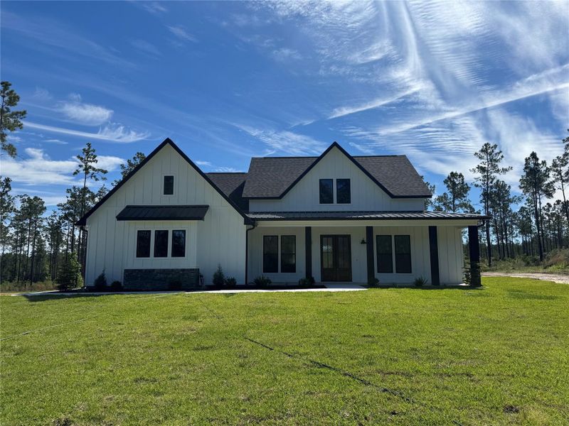 Front exterior of a new home in , Brookeland, TX, highlighting curb appeal (Image 26).