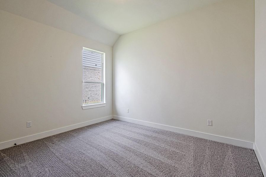 One of the secondary bedrooms offers flexibility as a guest room, home office, or hobby space One of the secondary bedrooms offers flexibility as a guest room, home office, or hobby space