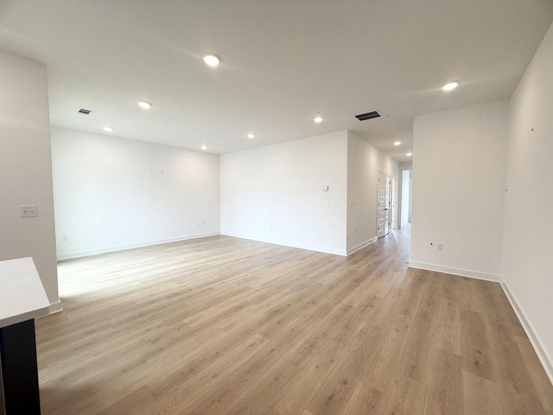 Unfurnished room featuring light wood-style floors, recessed lighting, and baseboards Unfurnished room featuring light wood-style floors, recessed lighting, and baseboards