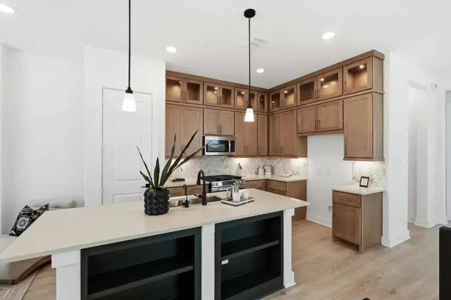 Representative furnished interior of a home built from the Calypso by Chesmar Homes in Centero at Stone Oak, San Antonio (Image 7).
