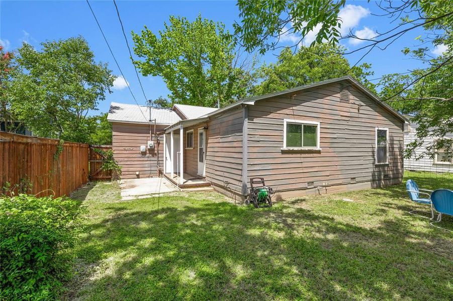 Back of house with a patio Back of house with a patio