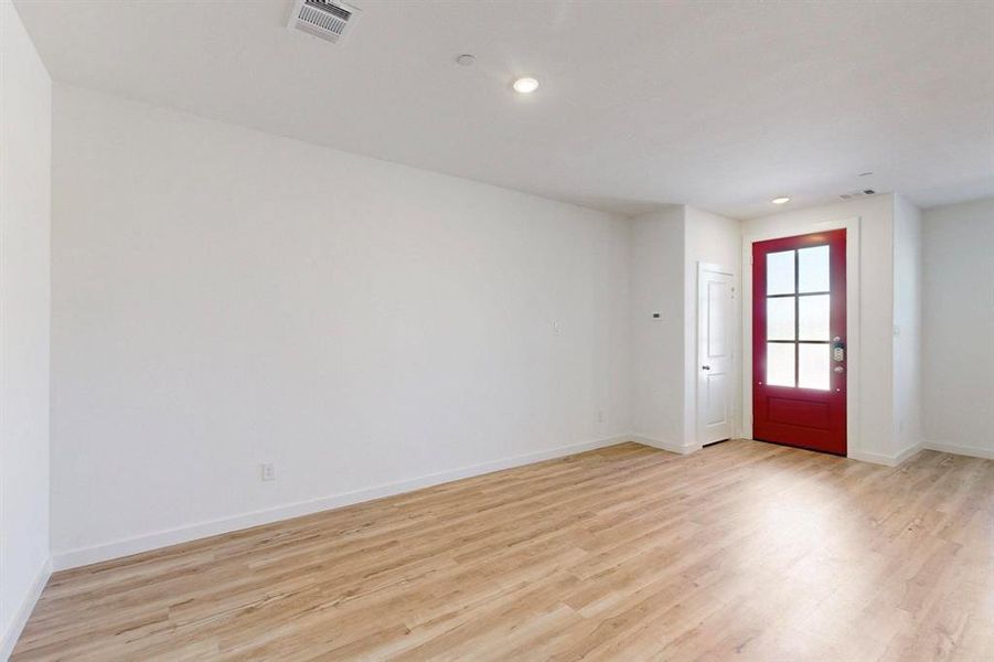 Entryway featuring light wood-type flooring and recessed lighting