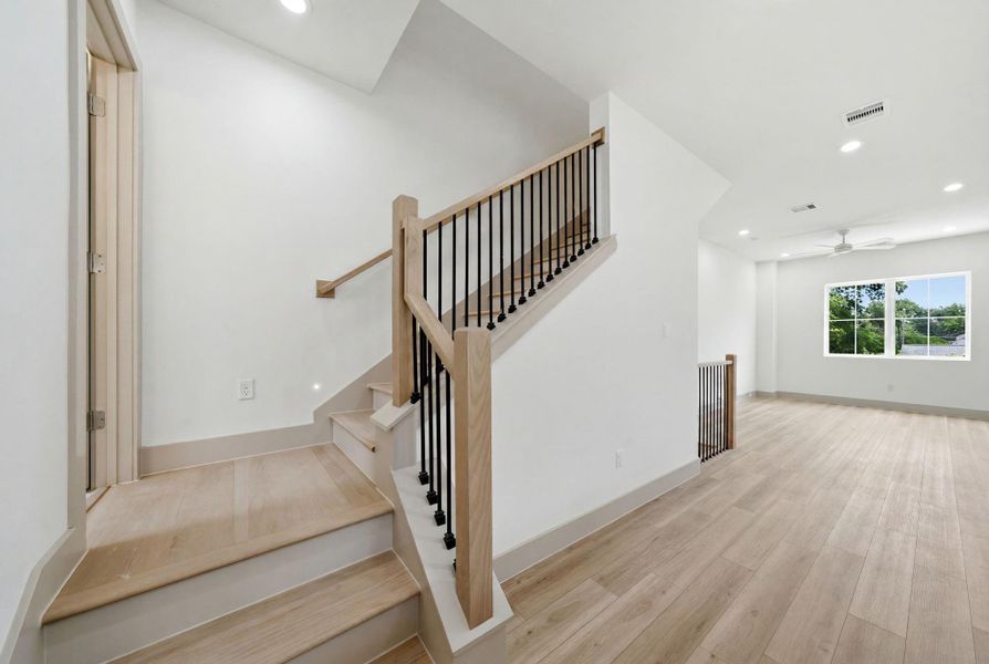 The half bath is tucked away through the door way on the left. Close by to the entertaining space, yet provides plenty of privacy