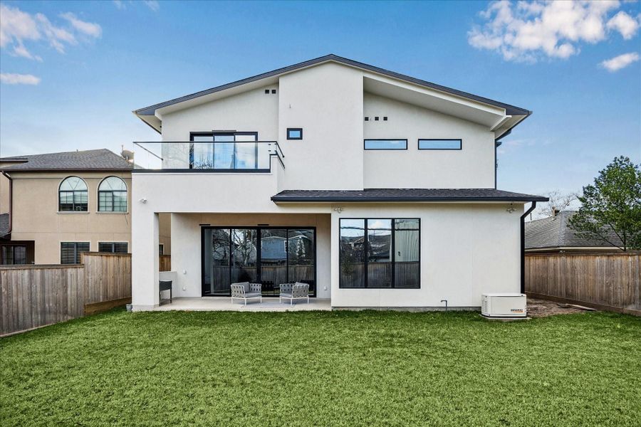 Plenty of grass space to enjoy in the backyard.