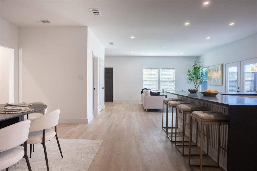 Dining area with light hardwood / wood-style floors