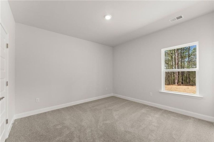 Spacious, unfurnished interior of a new home in Wood Creek Landing, Leland (Image 28).