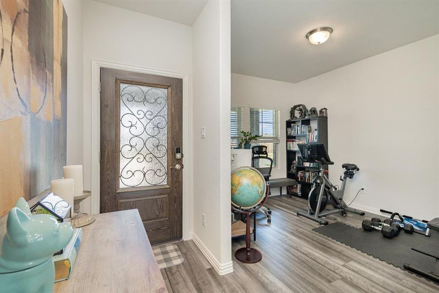 Foyer entrance featuring hardwood / wood-style floors