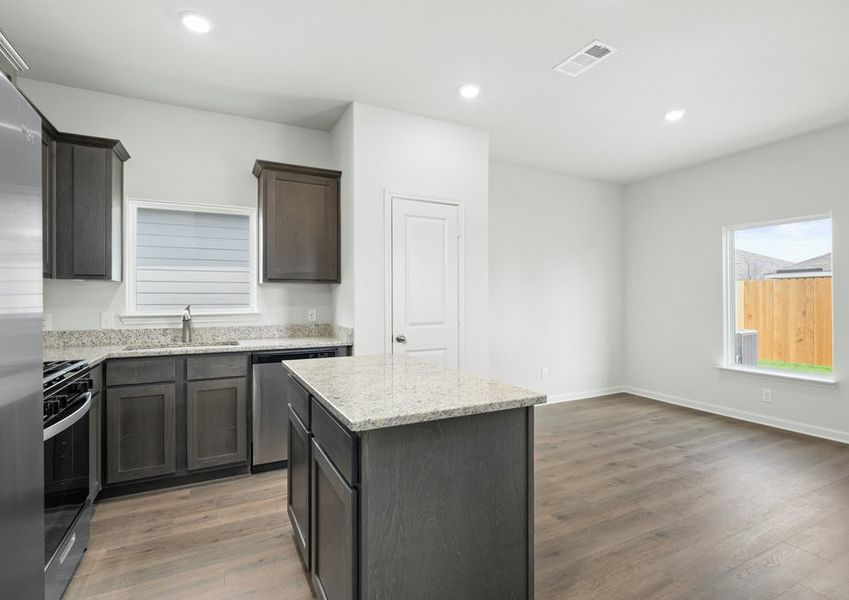 The dining room sits right off of the kitchen. The dining room sits right off of the kitchen.