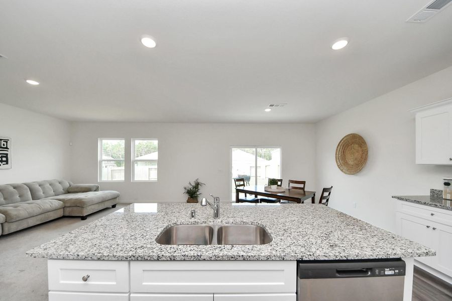 A view from the kitchen to the spacious backyard