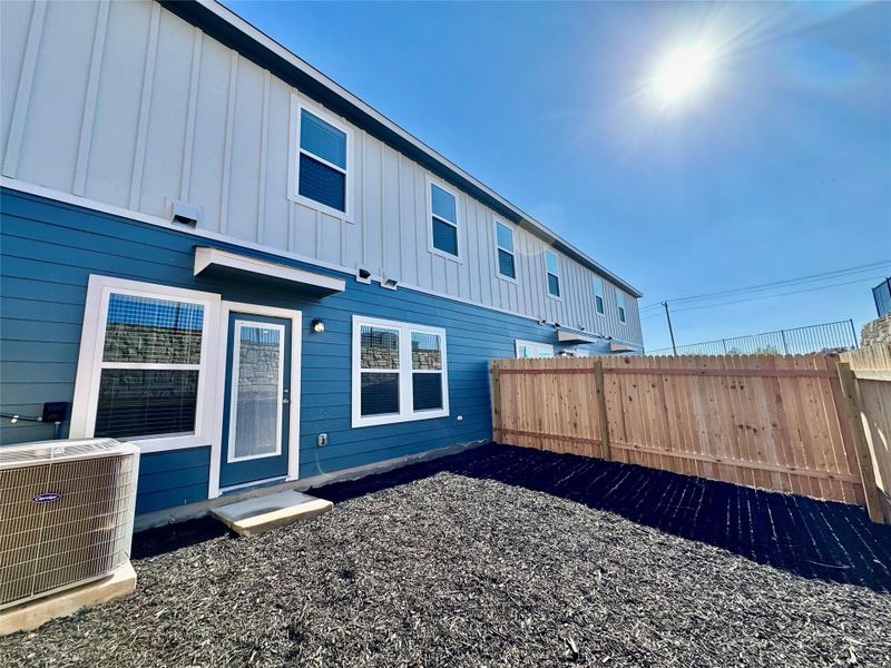 Back of property with board and batten siding