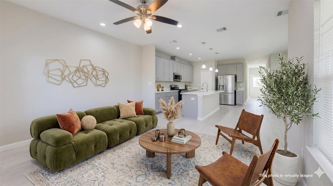 Sun-drenched and spacious, this move-in-ready living room offers the perfect inviting layout for your first home’s cozy gatherings.