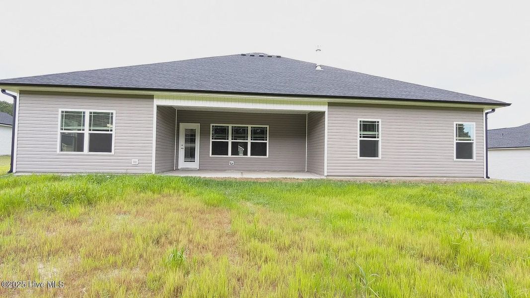 Front exterior of a new home in Harvest Creek, Nashville, NC, highlighting curb appeal (Image 2). Front exterior of a new home in Harvest Creek, Nashville, NC, highlighting curb appeal (Image 2).