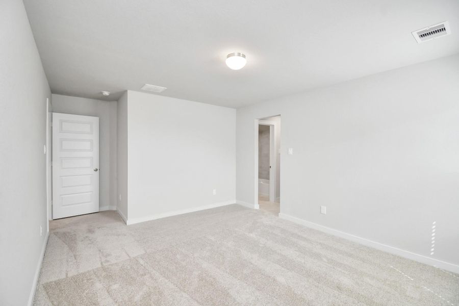 Generously sized secondary bedrooms featuring spacious closets, soft and inviting carpeting underfoot, large windows allowing plenty of natural light, and the added touch of privacy blinds for your personal retreat. Sample photo of completed home with similar floor plan. Actual colors and selections may vary.