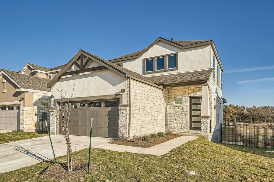Front exterior of a new home in Chester Ranch Place, Round Rock, TX, highlighting curb appeal (Image 1).